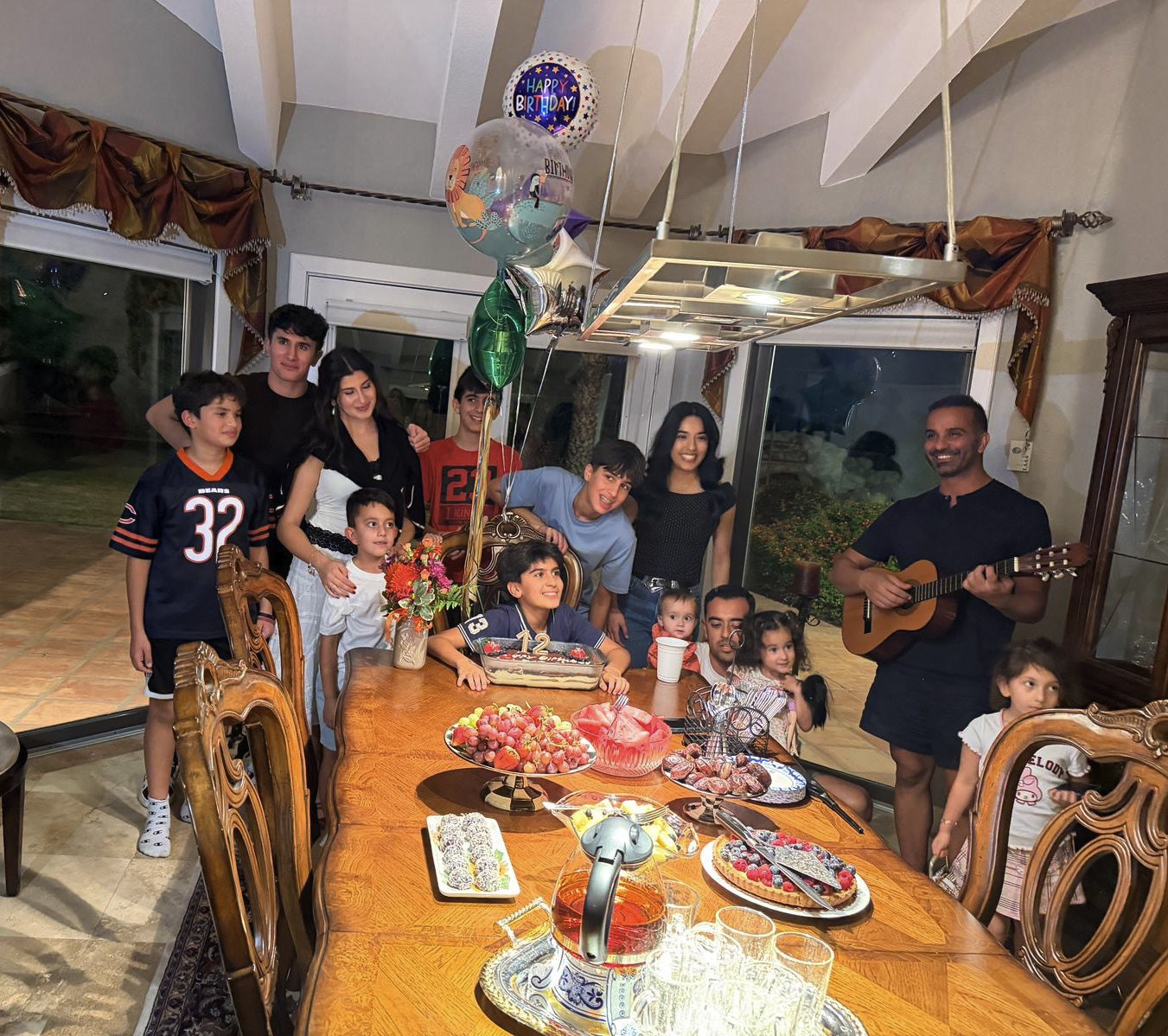 Pretending to play the guitar with cousins